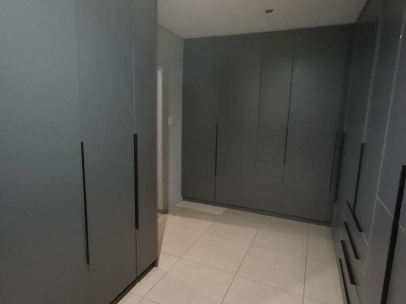 This property is just as lovely as the outside. As soon as you walk in the front door, you’re greeted by a warm and welcoming atmosphere. The house is spacious and has big aluminium windows that let in lots of natural light. - Photo 8