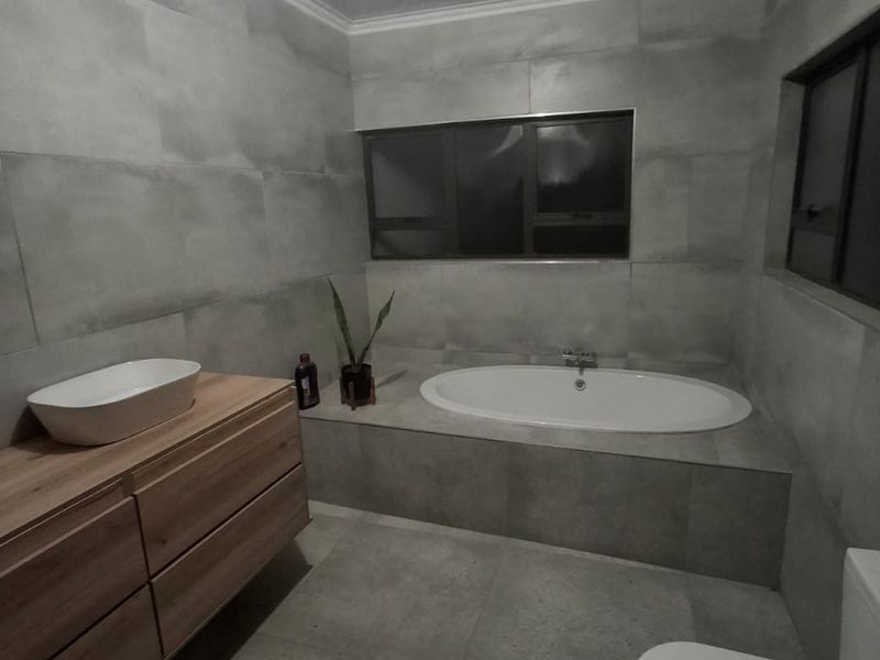 This property is just as lovely as the outside. As soon as you walk in the front door, you’re greeted by a warm and welcoming atmosphere. The house is spacious and has big aluminium windows that let in lots of natural light. - Photo 7