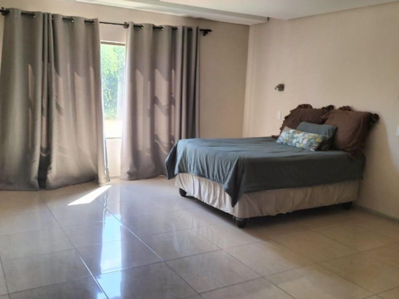 This property is just as lovely as the outside. As soon as you walk in the front door, you’re greeted by a warm and welcoming atmosphere. The house is spacious and has big aluminium windows that let in lots of natural light. - Photo 6