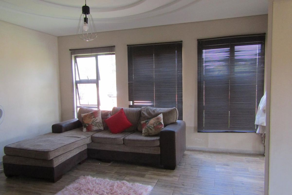 This property is just as lovely as the outside. As soon as you walk in the front door, you’re greeted by a warm and welcoming atmosphere. The house is spacious and has big aluminium windows that let in lots of natural light. - Photo 5