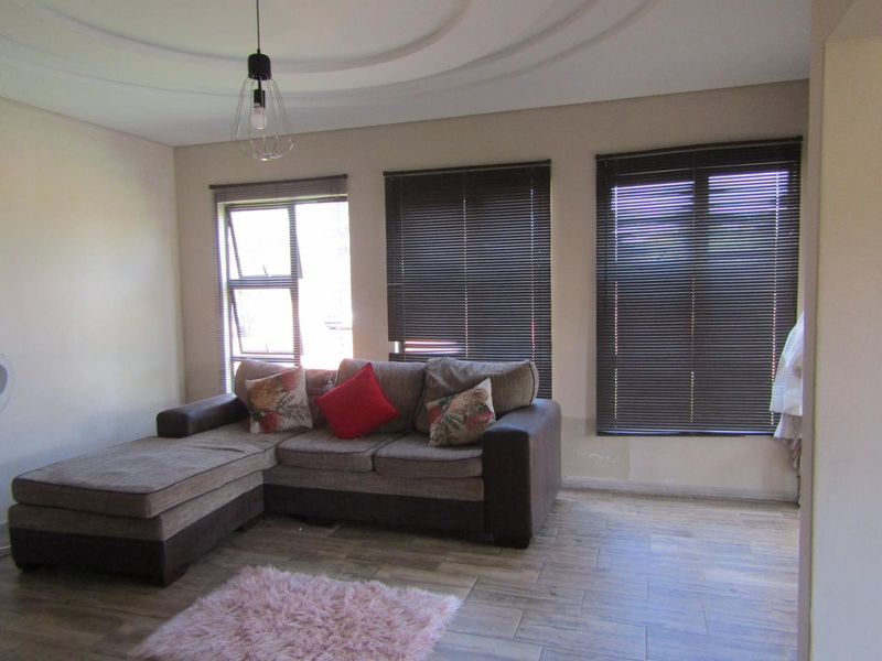 This property is just as lovely as the outside. As soon as you walk in the front door, you’re greeted by a warm and welcoming atmosphere. The house is spacious and has big aluminium windows that let in lots of natural light. - Photo 5
