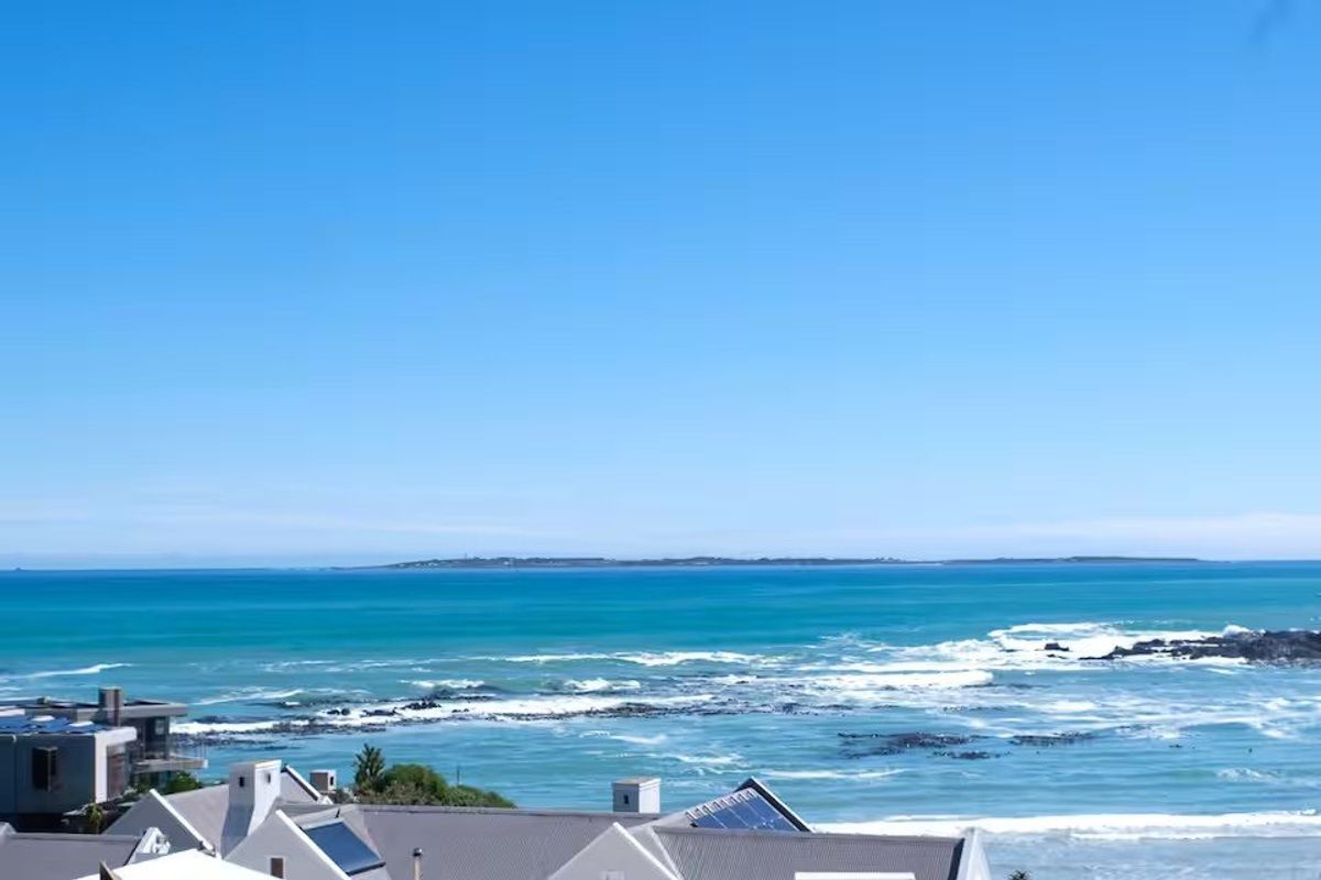 A scenic elevated view overlooking the ocean and coastline, showcasing the property's prime location.