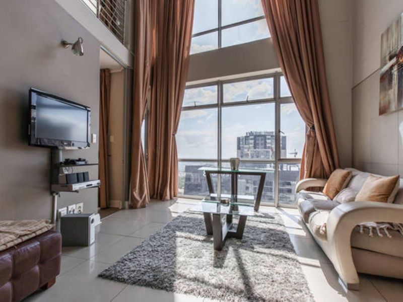 Stunning 3 Bedroom 3 Bath Penthouse in heart of Sandton Fully Furnished What a Steal- Reduced Price! - Photo 1