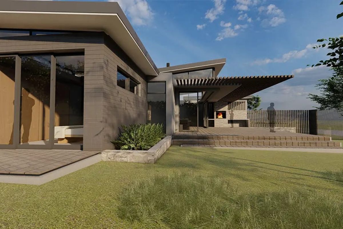 Modern rear exterior view featuring a spacious timber deck, built-in fireplace, pergola, and large sliding glass doors opening to the garden.