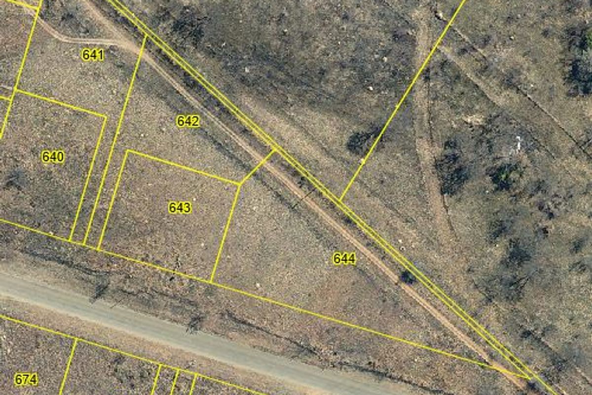 An aerial view showing the cadastral layout and boundary lines for vacant residential plots in a rural setting.
