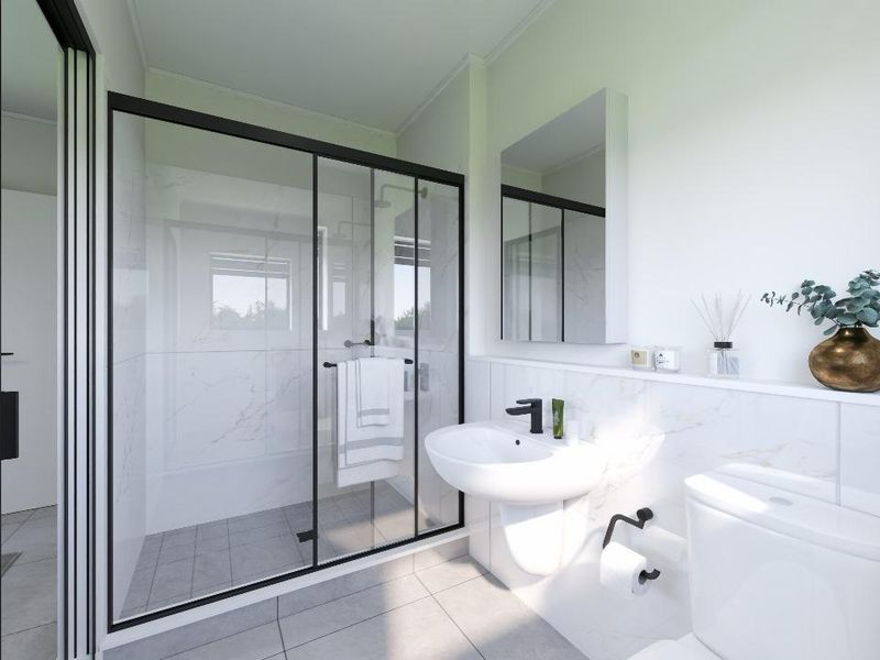 Modern bathroom featuring a walk-in shower with black-framed glass, pedestal sink, wall-mounted mirror cabinet, and elegant marble-look wall tiling.
