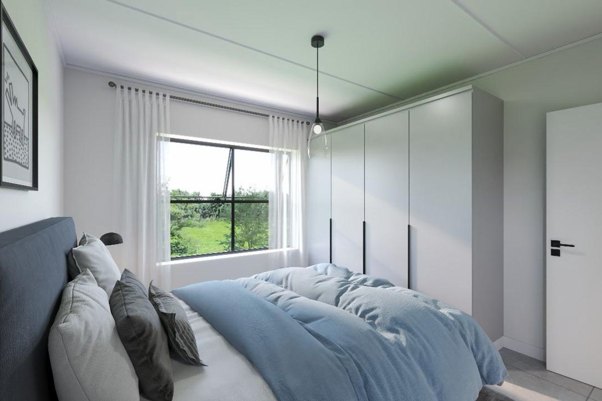 A modern bedroom featuring a built-in wardrobe, a pendant light fixture, and a window with a view of the surrounding greenery.