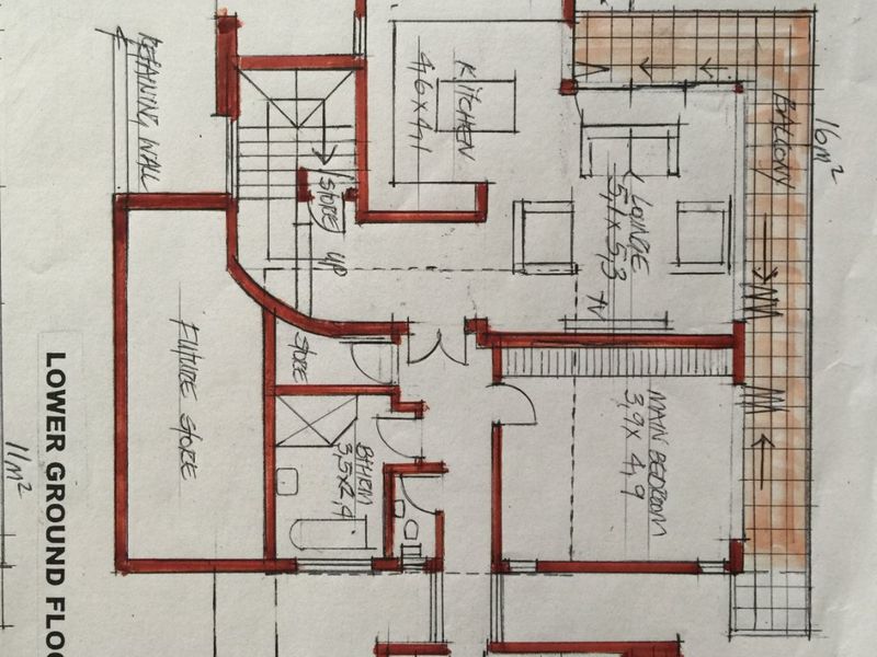 Hand-drawn lower ground floor plan showing the layout of the kitchen, lounge, bedrooms, bathrooms, and balconies.