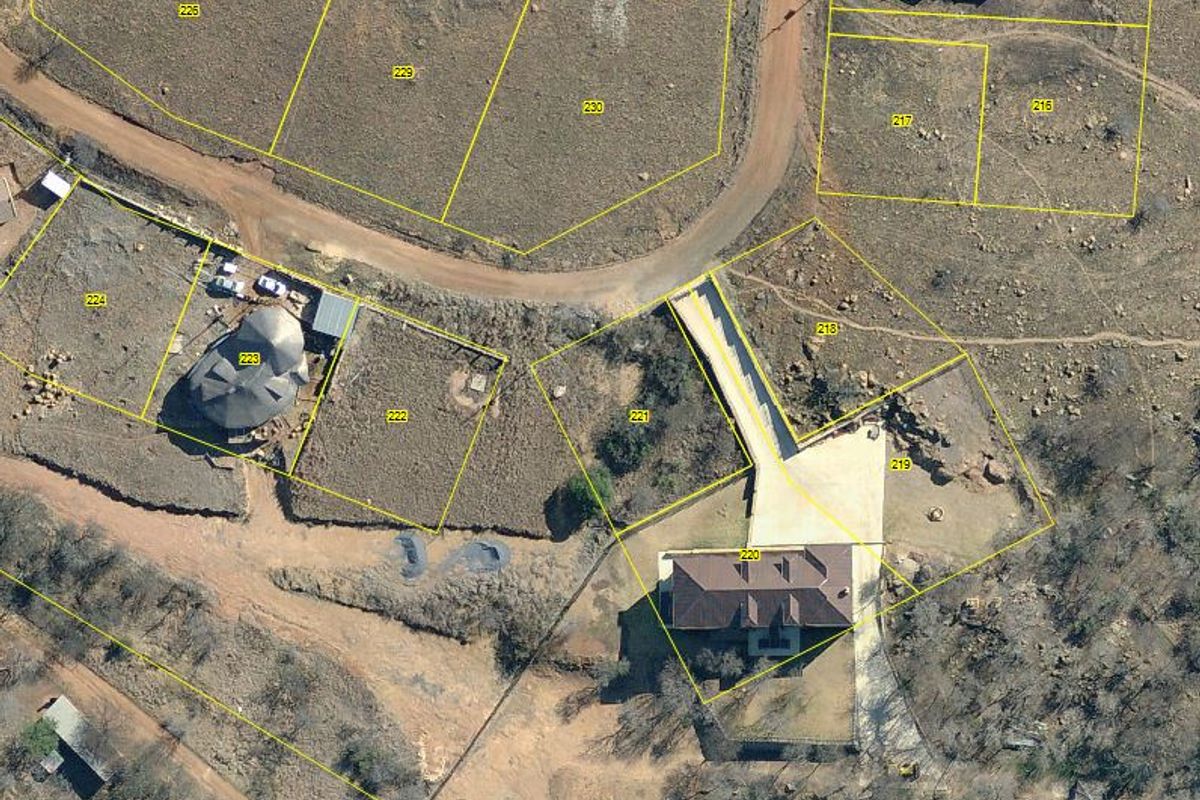 Aerial view of a residential property showing plot boundaries, access driveway, and existing building structure within a rural estate setting.