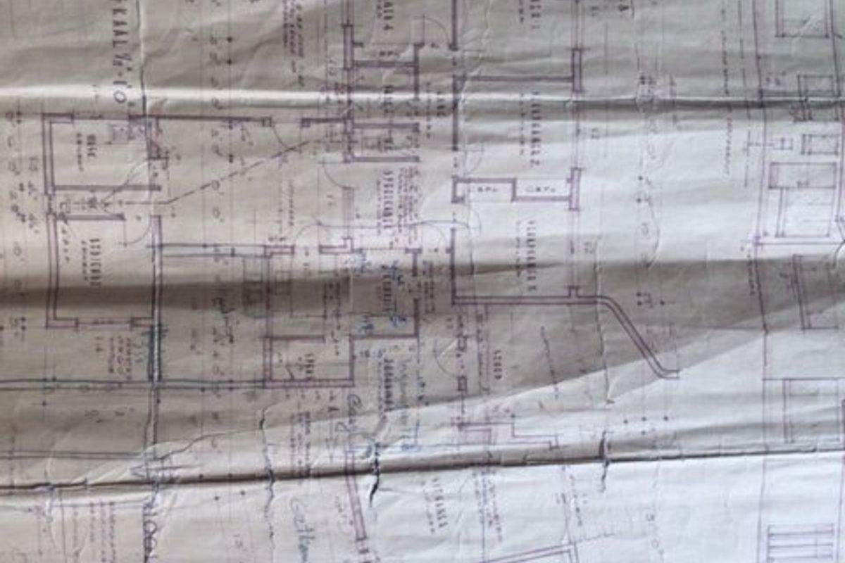 A physical paper copy of the property floor plan showing the layout and architectural design.