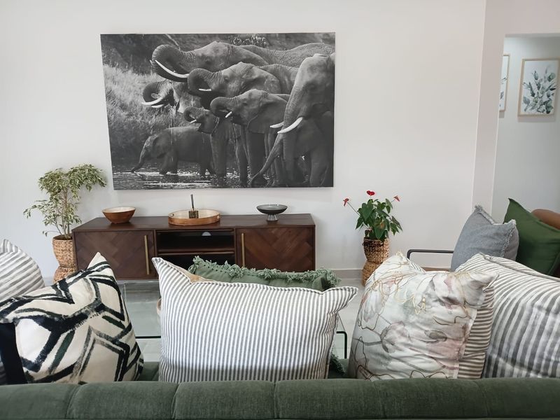 A well-maintained living room space featuring neutral wall finishes and a clean, modern aesthetic.