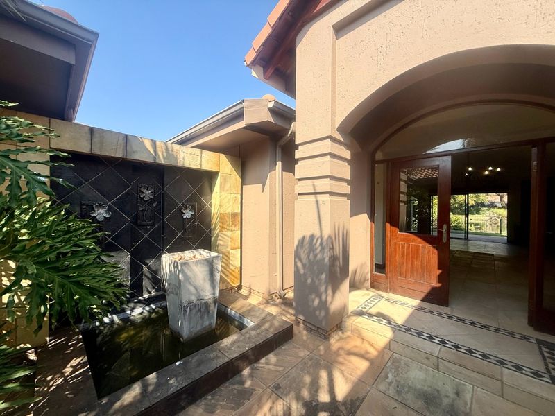 Elegant 4-Bedroom Home with Dam & Golf Course Views | Pecanwood Estate - Photo 1