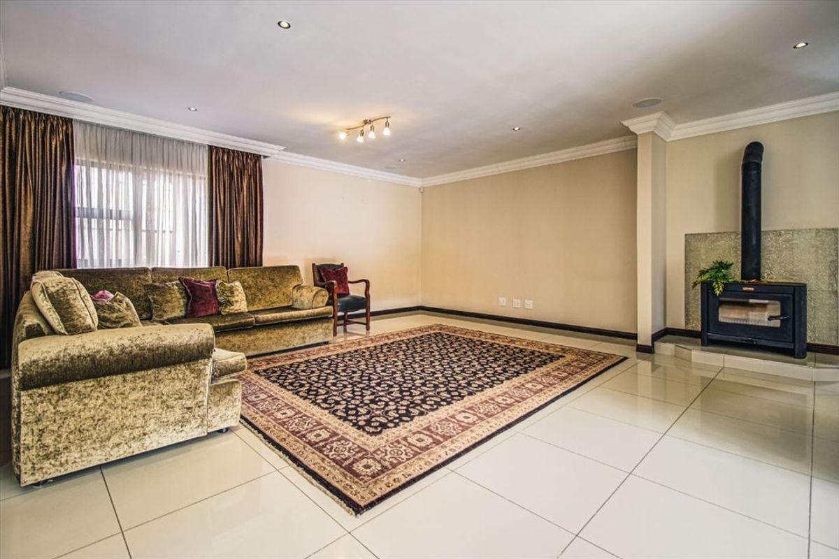 Elegant Family Home with Staff Accommodation and Triple Garage - Photo 2