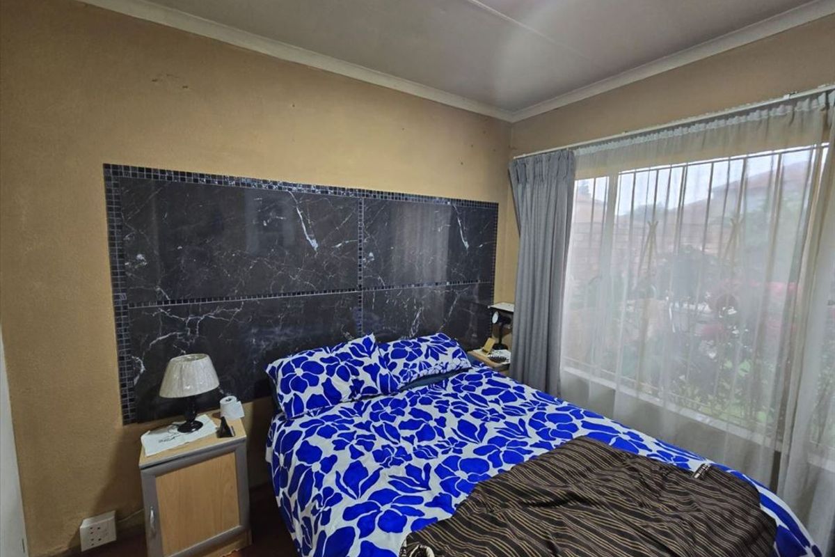 Cozy Two-Bedroom Home with Secure Garage - Photo 2