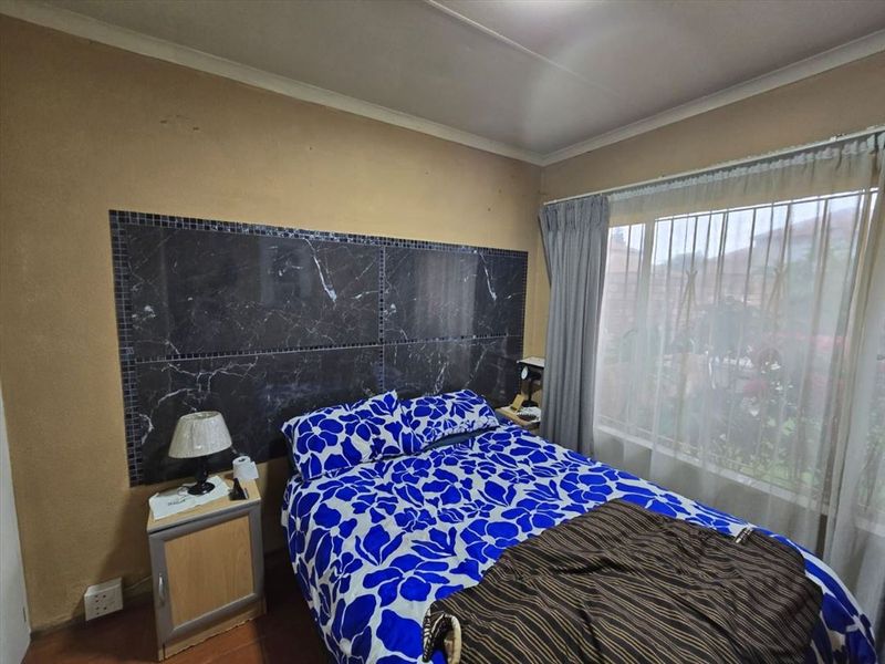 Cozy Two-Bedroom Home with Secure Garage - Photo 2