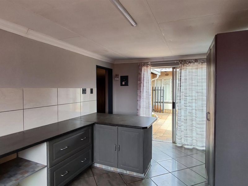 Spacious 4-Bedroom Family Home with an Income-Generating 2-Bedroom Flatlet in New State Areas! - Photo 2