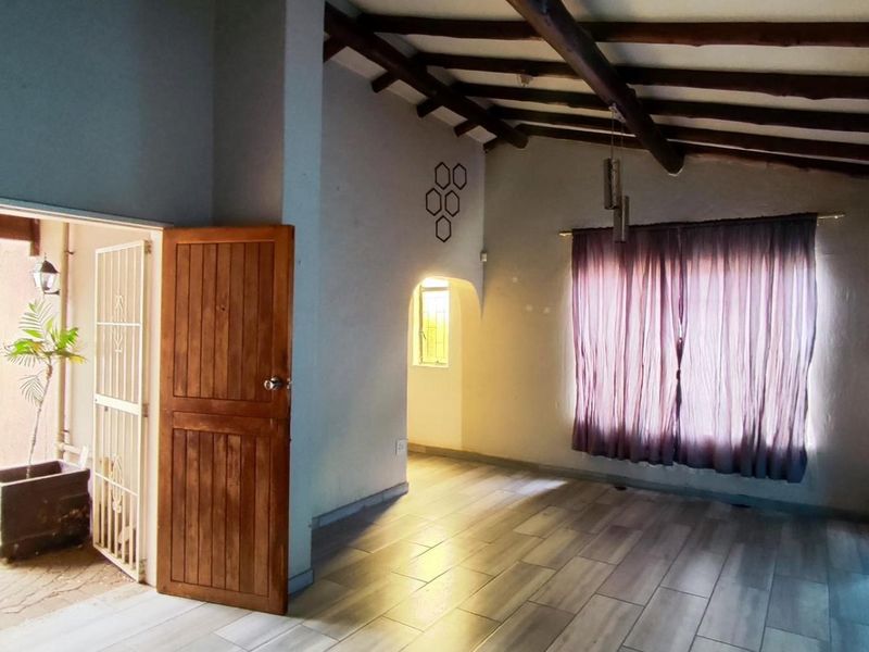 Spacious 4-Bedroom Family Home with an Income-Generating 2-Bedroom Flatlet in New State Areas! - Photo 4