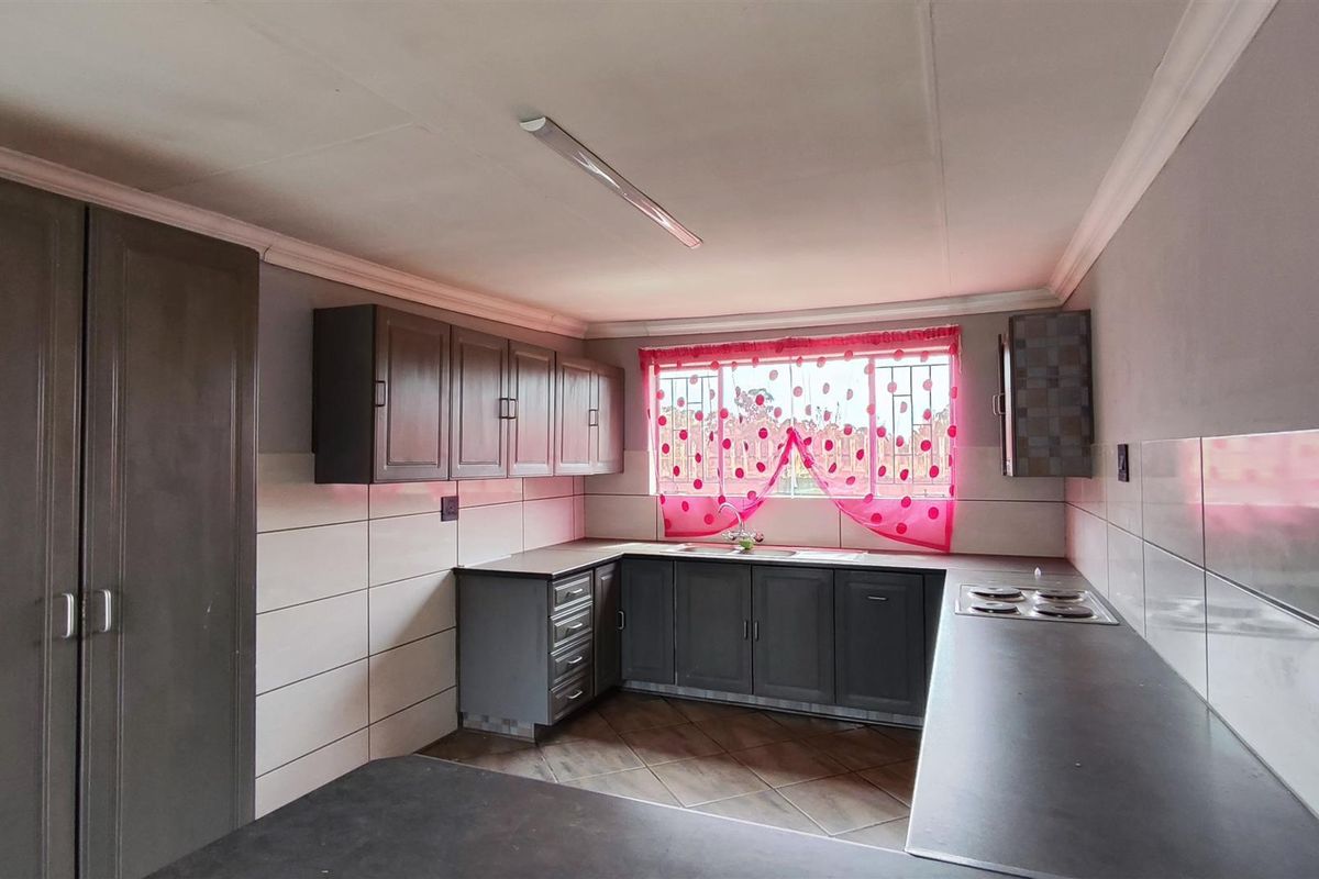Spacious 4-Bedroom Family Home with an Income-Generating 2-Bedroom Flatlet in New State Areas! - Photo 3