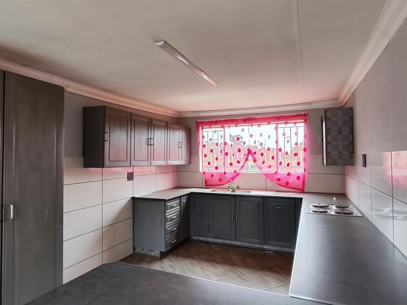 Spacious 4-Bedroom Family Home with an Income-Generating 2-Bedroom Flatlet in New State Areas! - Photo 3