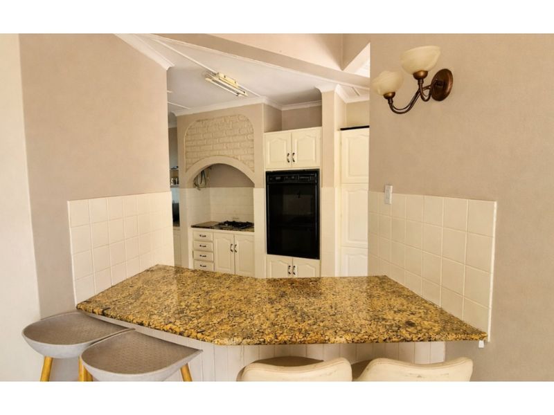 Modern, Vincent Heights Family Retreat with Poolside Charm and Large Erf and Financial Bonuses! - Photo 9