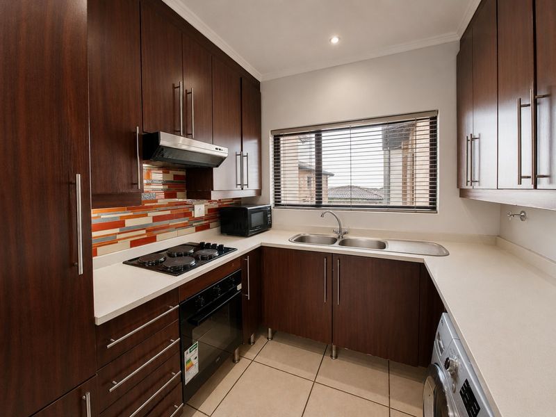 Greenstone Hill Gem with Open Plan Living and balcony with built in Braai. - Photo 2