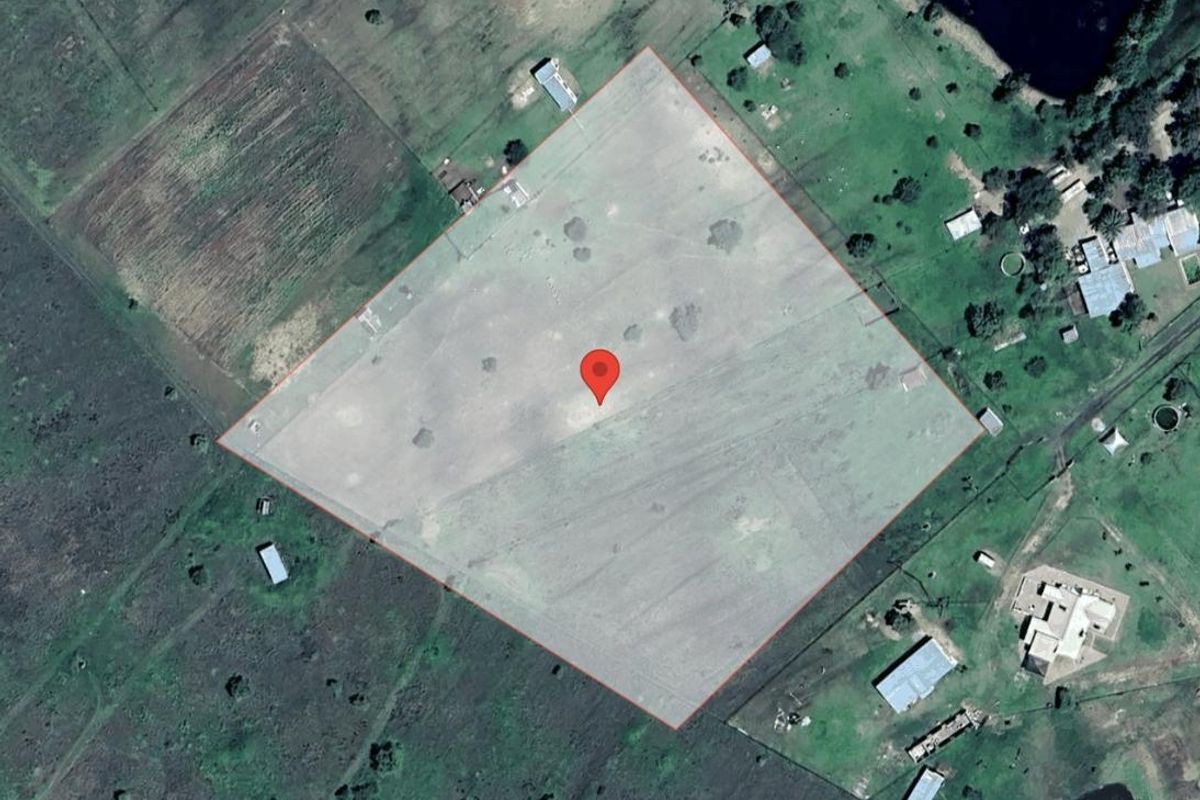 An aerial satellite view showing the property boundaries and surrounding rural landscape.
