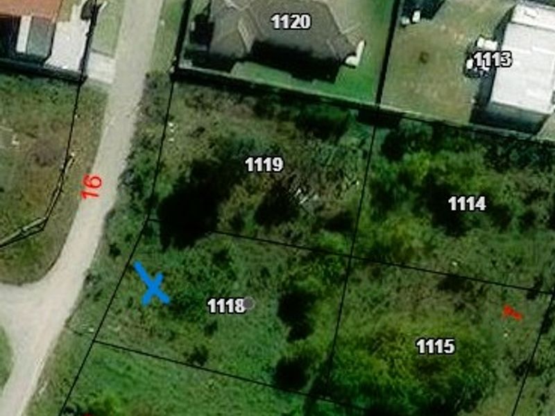 Aerial view of a residential vacant land plot, showing site boundaries and surrounding neighborhood context.