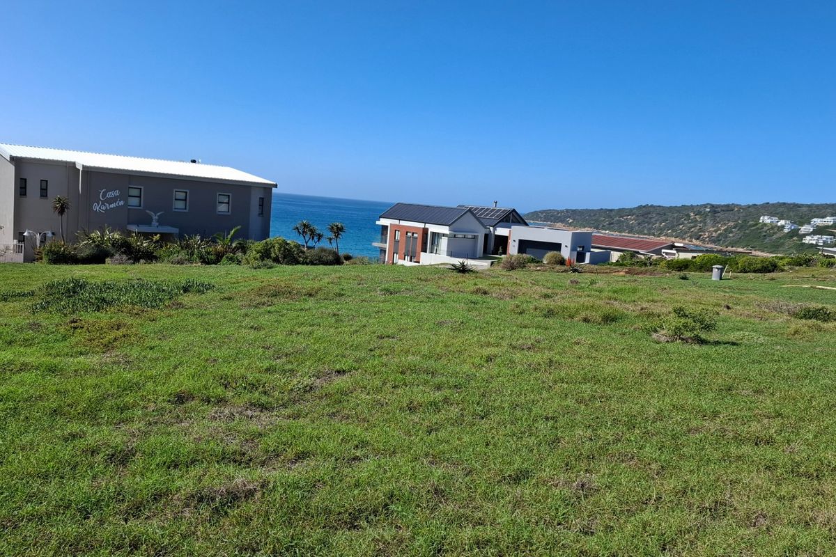 A scenic view of the coastal landscape and ocean from the vacant residential land, showcasing the surrounding neighborhood and natural environment.