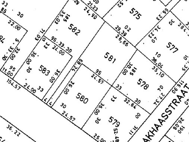 A cadastral survey map showing the layout and dimensions of residential land plots in the area.