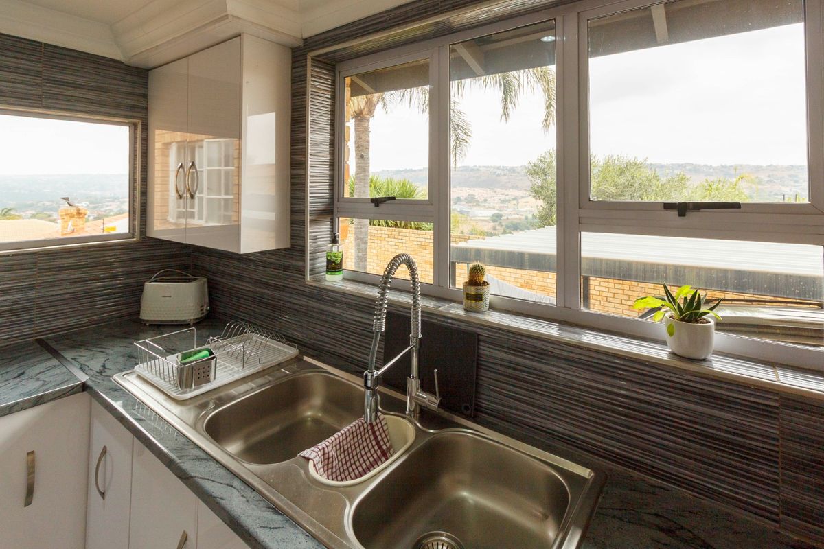 Elegant Family Living with Breathtaking Views in Rangeview - Photo 4