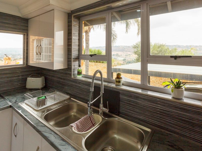 Elegant Family Living with Breathtaking Views in Rangeview - Photo 4