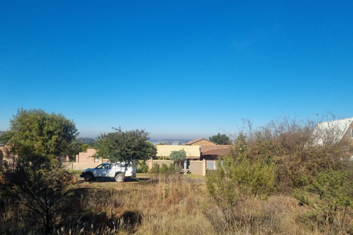 A view of the surrounding residential neighbourhood and landscape from the vacant residential plot.
