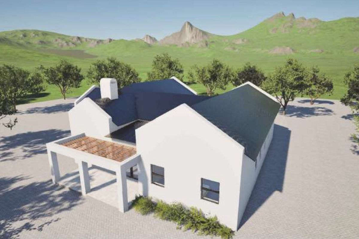 An aerial view of a modern house featuring a pitched roof, a chimney, and an attached pergola, set against a scenic landscape.