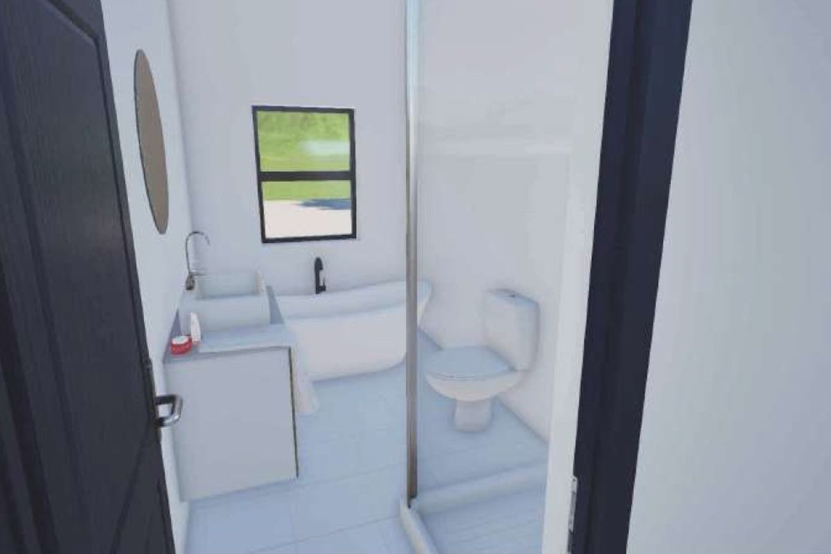 A modern, minimalist bathroom featuring a freestanding bathtub, a vanity with basin, a toilet, and a glass-enclosed shower.