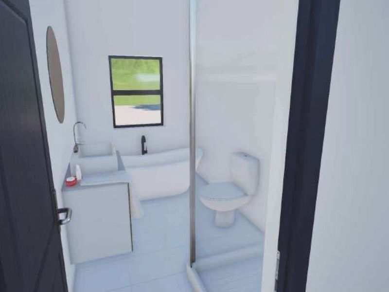 A modern, minimalist bathroom featuring a freestanding bathtub, a vanity with basin, a toilet, and a glass-enclosed shower.