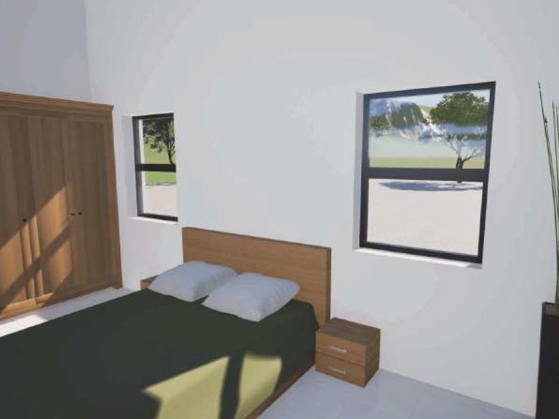 A bedroom interior featuring a built-in wardrobe and aluminium window frames, presented as a 3D architectural render.