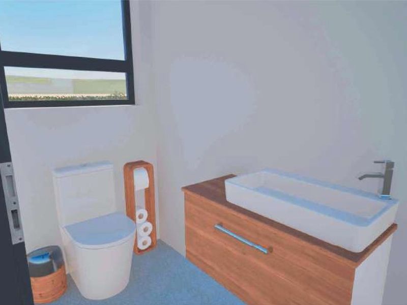 A modern bathroom featuring a wall-mounted vanity with a vessel basin and a contemporary toilet.