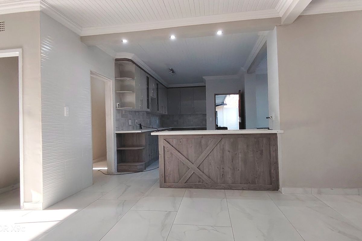 Stylishly renovated family home with pool in sought-After Risiville - Photo 2