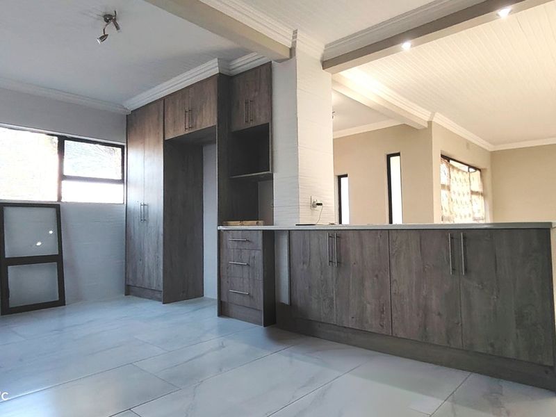 Stylishly renovated family home with pool in sought-After Risiville - Photo 7