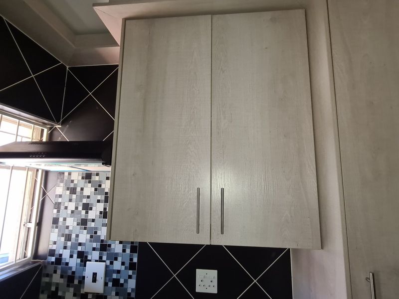Spacious townhouse superbly situated across from the Shoprite complex in Stilfontein Extension 4. - Photo 8