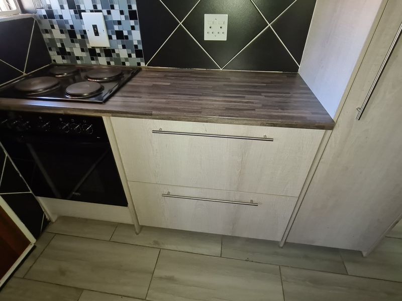 Spacious townhouse superbly situated across from the Shoprite complex in Stilfontein Extension 4. - Photo 7