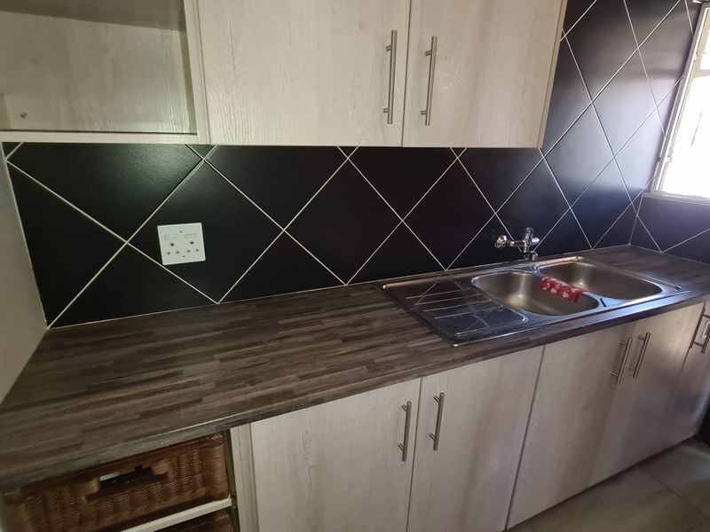 Spacious townhouse superbly situated across from the Shoprite complex in Stilfontein Extension 4. - Photo 6