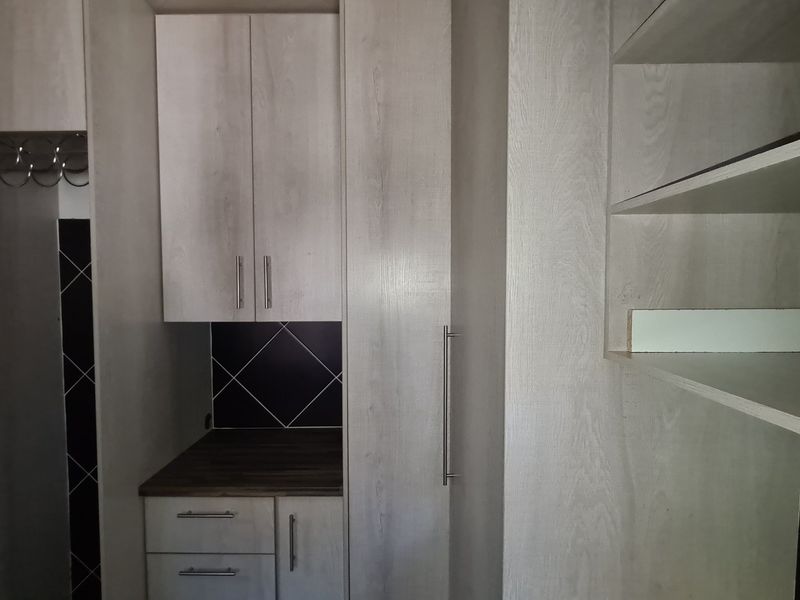 Spacious townhouse superbly situated across from the Shoprite complex in Stilfontein Extension 4. - Photo 5