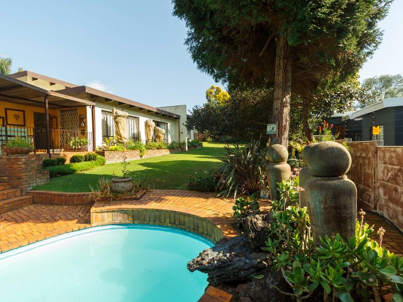 Timeless Family Living with Beautiful Gardens and Exceptional Space - Photo 1