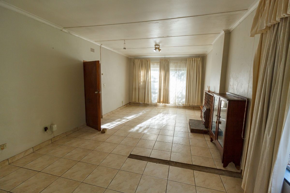 Charming Family Home with Enclosed Veranda and Beautiful Vegetable Garden - Photo 4