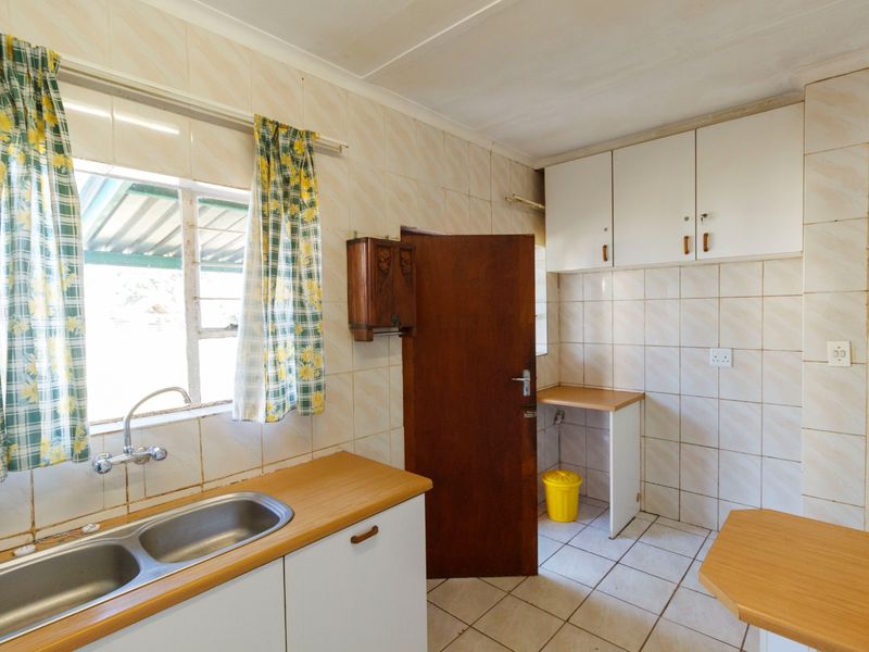 Charming Family Home with Enclosed Veranda and Beautiful Vegetable Garden - Photo 9