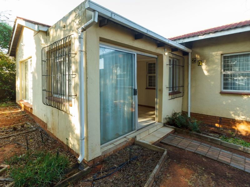 Charming Family Home with Enclosed Veranda and Beautiful Vegetable Garden - Photo 1