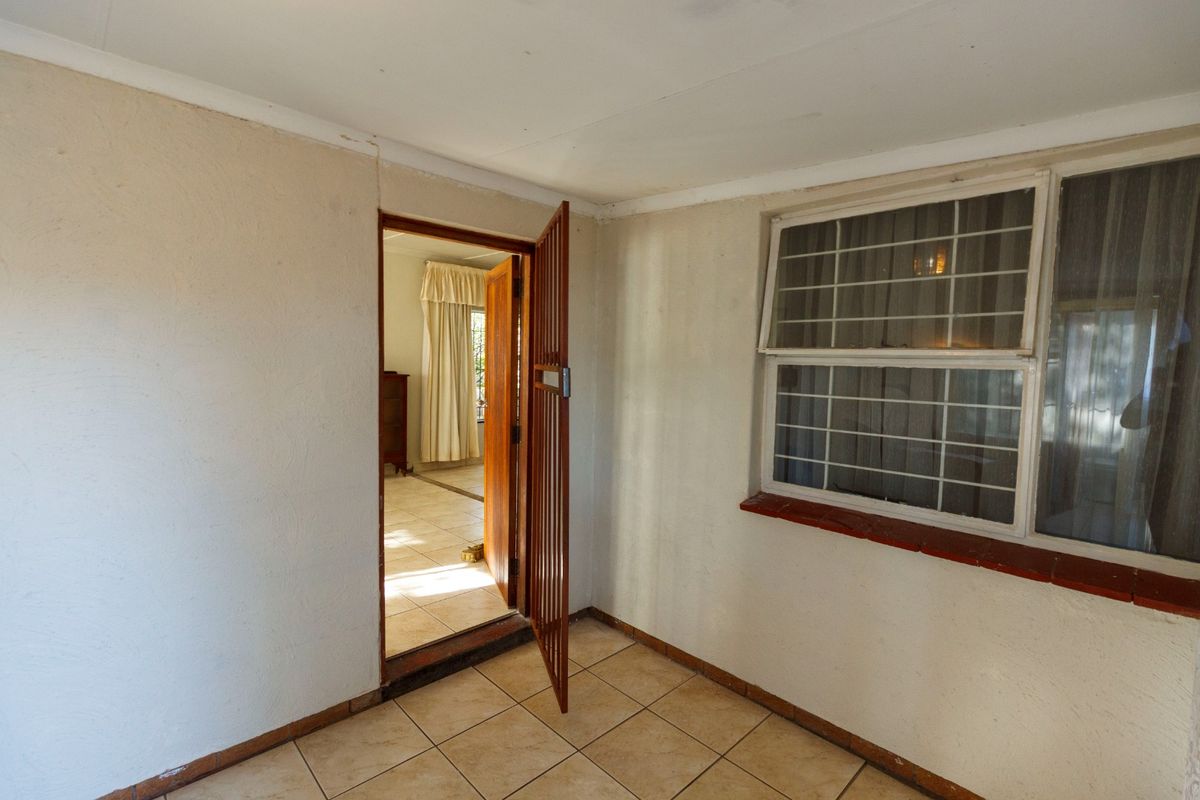 Charming Family Home with Enclosed Veranda and Beautiful Vegetable Garden - Photo 3