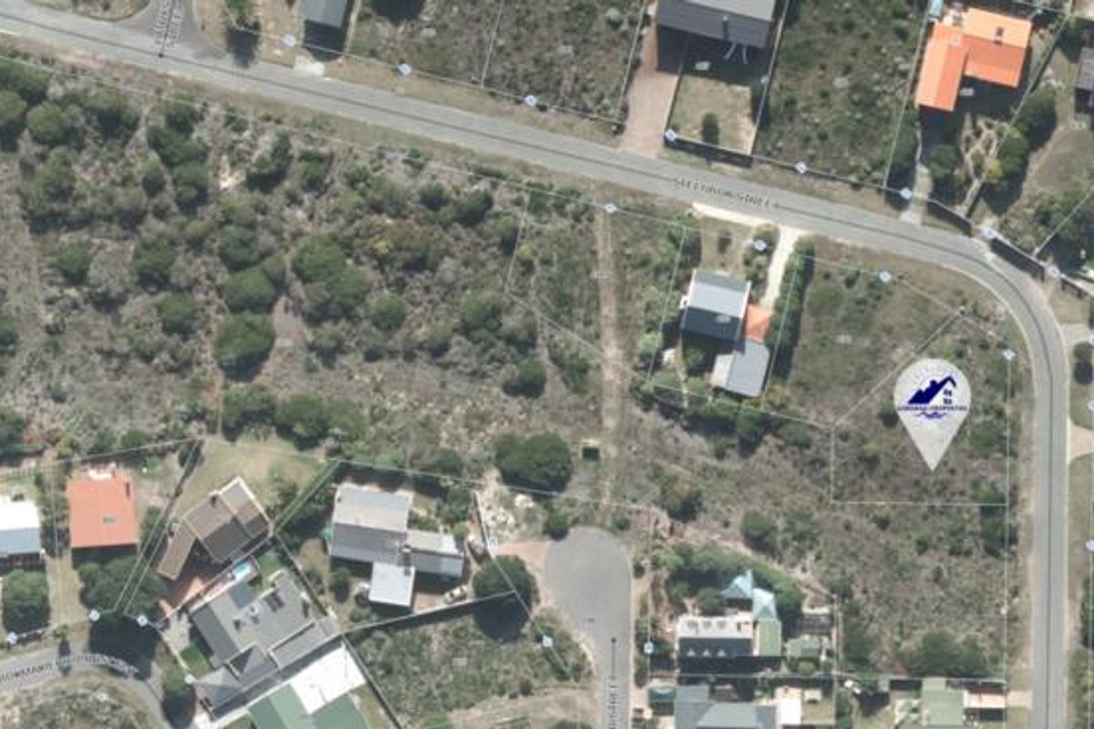 Aerial view of a vacant residential plot showing property boundaries and surrounding neighborhood infrastructure.