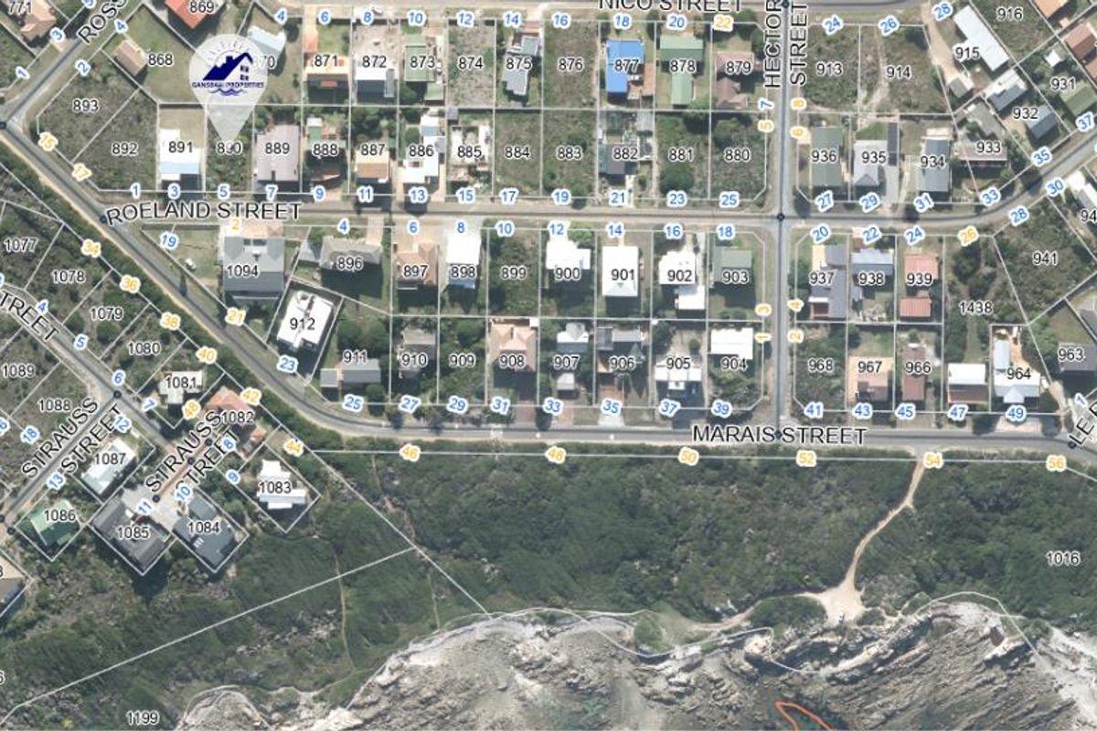 An aerial view of the residential neighborhood and coastal land layout, showing street access and proximity to the coastline.